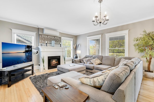 1909 Fremont Ave S Unit 201, Minneapolis, MN 55403 - living area featuring a chandelier, ornamental molding, wood-type flooring, a glass covered fireplace, and a wall mounted AC