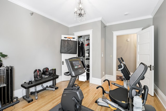 1909 Fremont Ave S Unit 201, Minneapolis, MN 55403 - exercise room with light wood-style flooring, crown molding, baseboards, and a chandelier