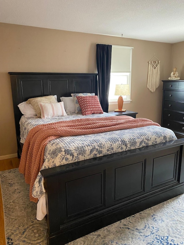 bedroom with wood finished floors
