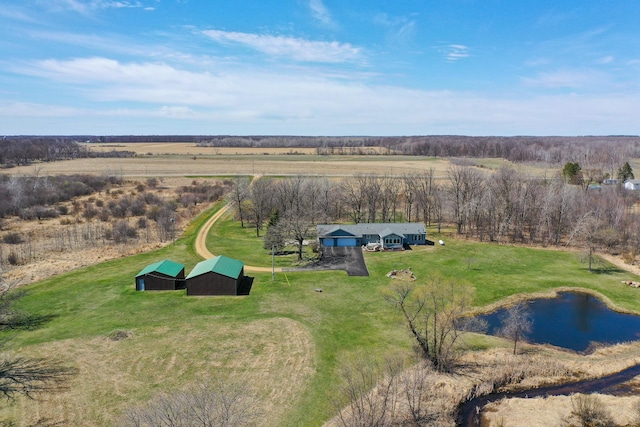 birds eye view of property featuring a rural view and a water view