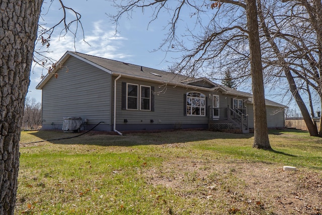 back of house with a yard