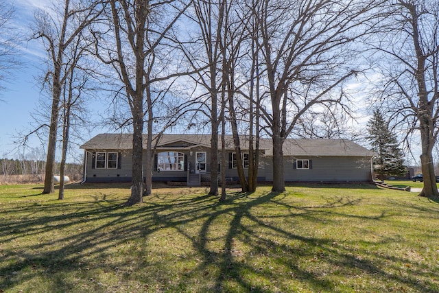 view of front of property with a front yard and crawl space
