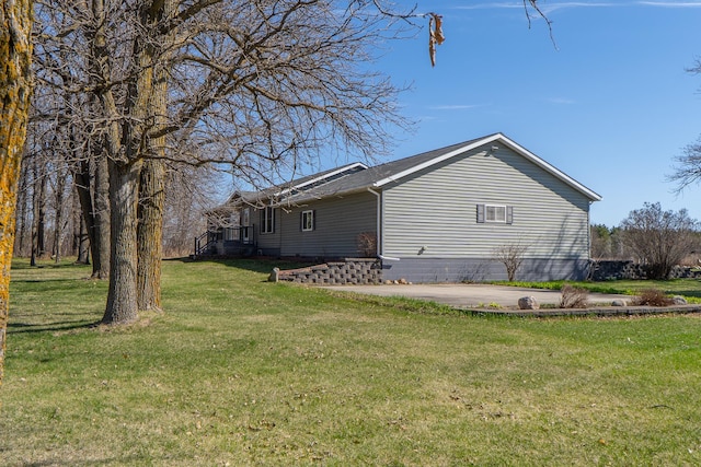 view of property exterior with a lawn