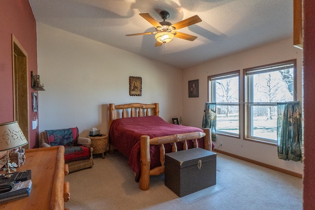 bedroom with light colored carpet, a ceiling fan, baseboards, and lofted ceiling
