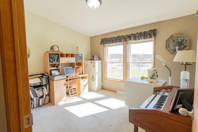 office space featuring light colored carpet and baseboards