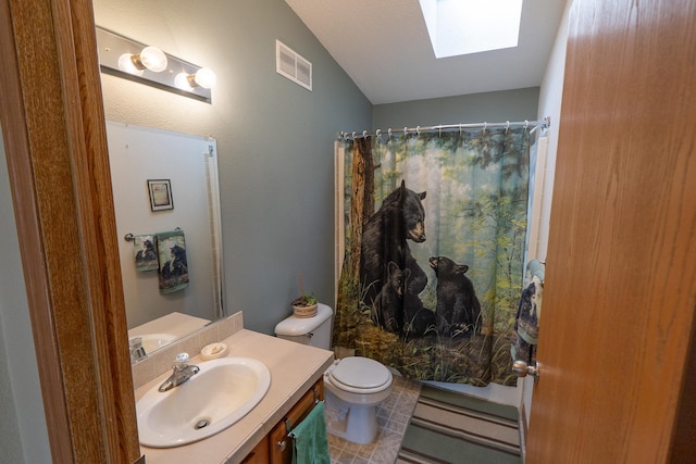 bathroom with curtained shower, a skylight, visible vents, and vanity