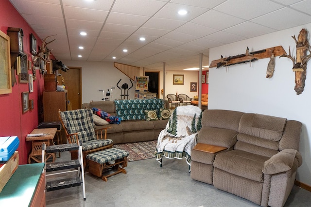 living room featuring concrete flooring and recessed lighting