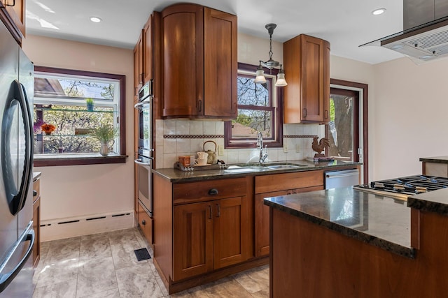 kitchen featuring a sink, appliances with stainless steel finishes, exhaust hood, healthy amount of natural light, and recessed lighting