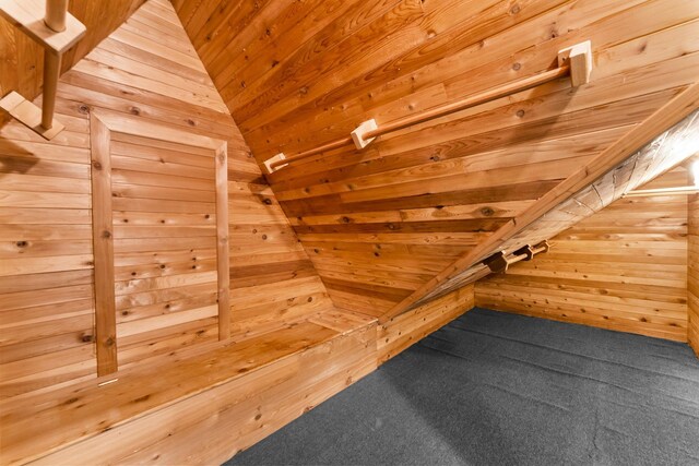 bonus room featuring wooden walls, carpet, a relaxing sauna, and wood ceiling