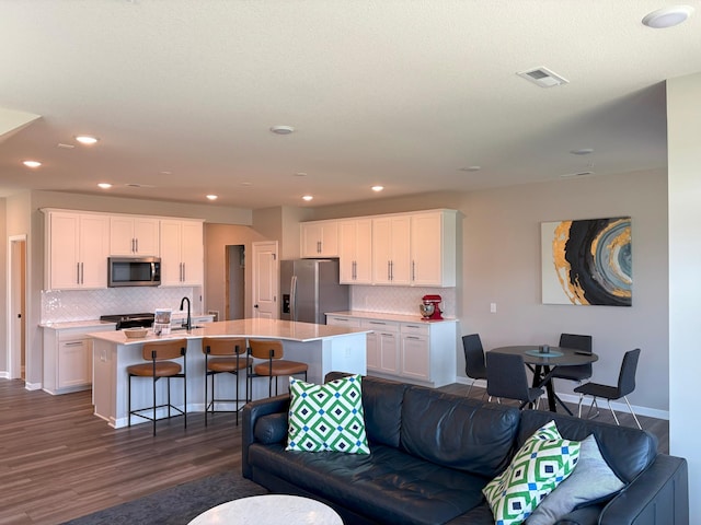 17935 Giants Way, Lakeville, MN 55044 - living room with dark wood-style floors, baseboards, and recessed lighting