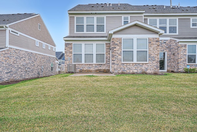 17935 Giants Way, Lakeville, MN 55044 - rear view of house featuring stone siding, a lawn, and a patio