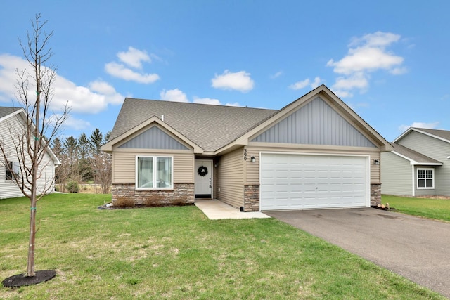 view of front of property with board and batten siding, an attached garage, stone siding, and aphalt driveway