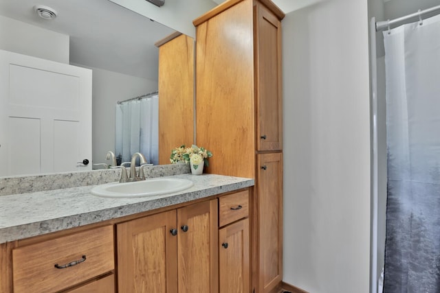full bathroom with vanity and a shower with shower curtain
