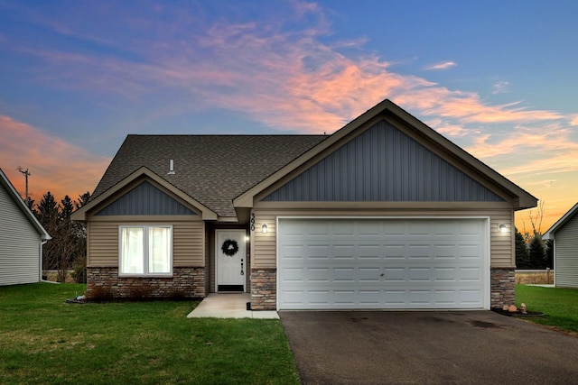 390 Ladd Ln, Osceola, WI 54020 - view of front of property featuring asphalt driveway, stone siding, board and batten siding, and a front yard