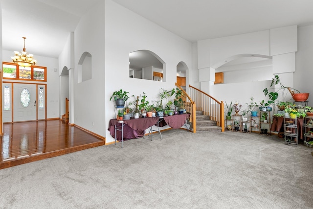 6300 Linden Ln, Mound, MN 55364 - carpeted entryway featuring a chandelier, a high ceiling, and stairway