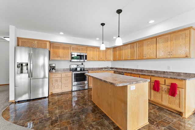 6300 Linden Ln, Mound, MN 55364 - kitchen with stainless steel appliances, a kitchen island, recessed lighting, decorative light fixtures, and a sink