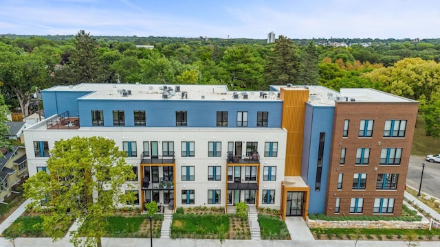 view of property featuring a view of trees