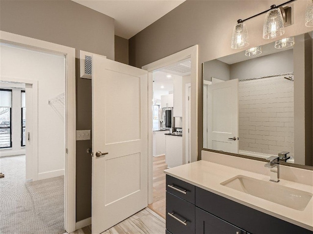 bathroom with visible vents and vanity