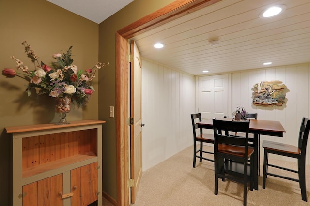 carpeted dining space featuring recessed lighting