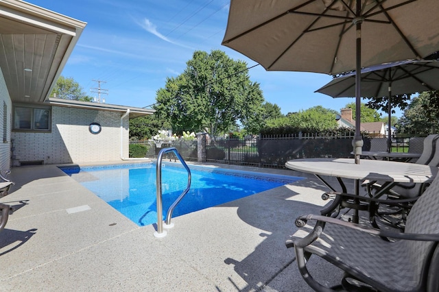 view of pool featuring fence, a fenced in pool, and a patio