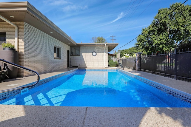 view of swimming pool featuring a fenced in pool and fence