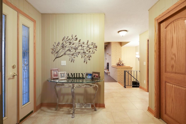 entryway with light tile patterned floors