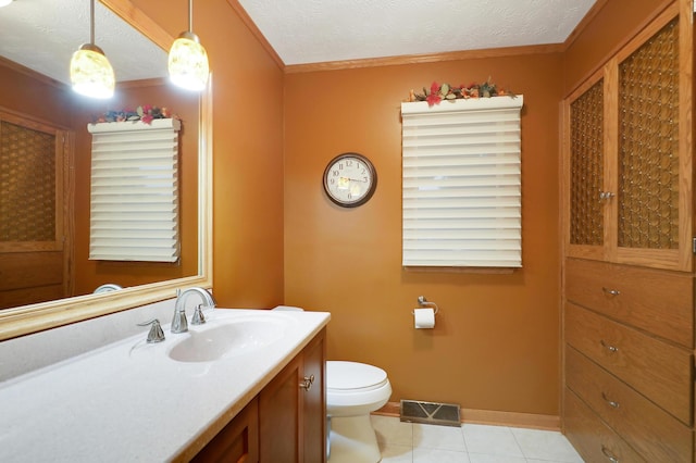 bathroom with crown molding, tile patterned flooring, vanity, toilet, and visible vents
