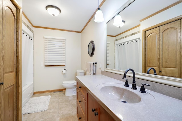 bathroom featuring tile patterned flooring, ornamental molding, vanity, toilet, and baseboards