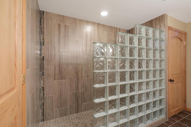bathroom featuring recessed lighting and a walk in shower
