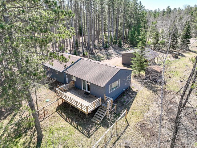 aerial view featuring a wooded view