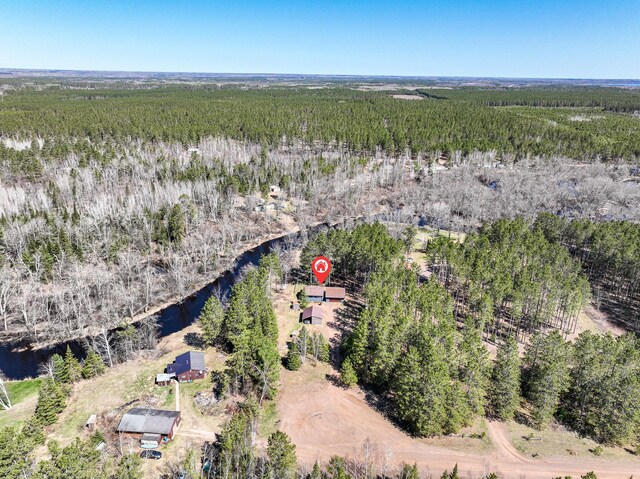 aerial view featuring a water view and a view of trees