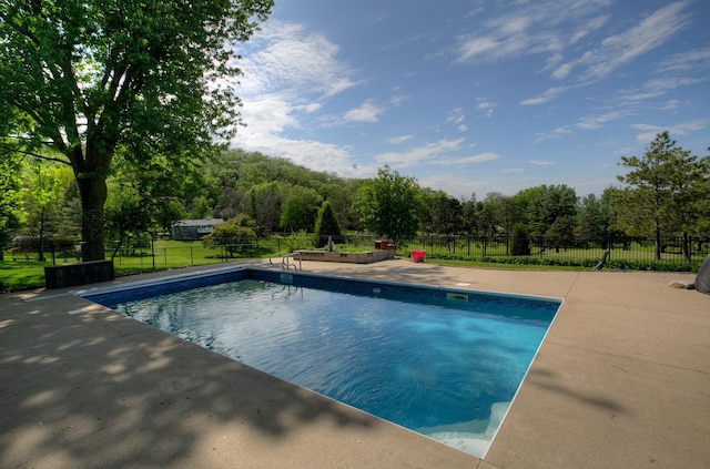 1224 Tee Up Ln, Red Wing, MN 55066 - view of swimming pool with a patio area and view of wooded area