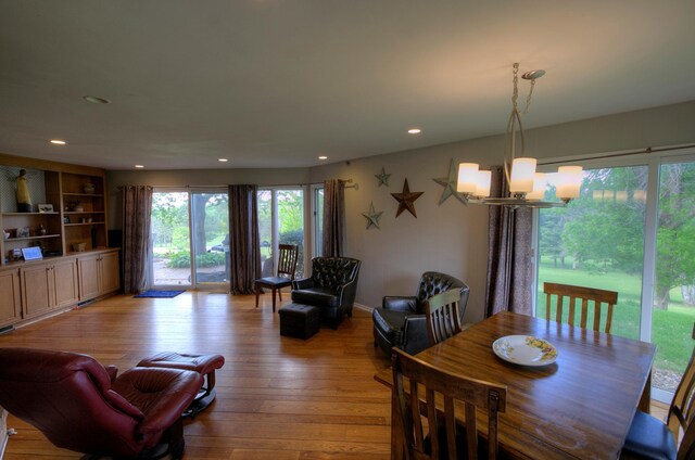 1224 Tee Up Ln, Red Wing, MN 55066 - dining room featuring light wood-style floors, recessed lighting, and a chandelier