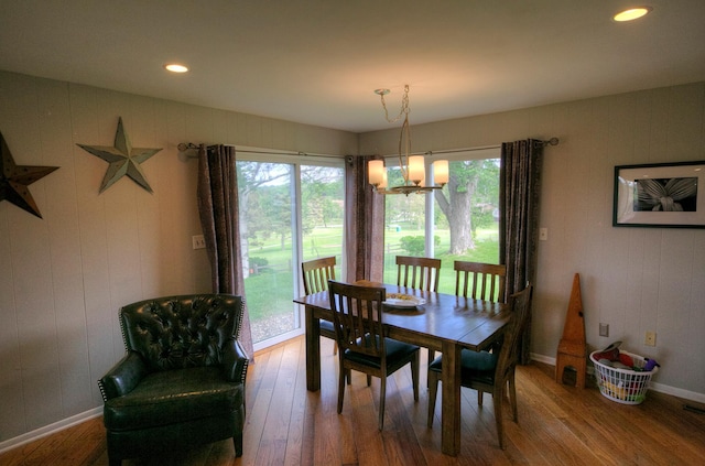 1224 Tee Up Ln, Red Wing, MN 55066 - dining area featuring wood finished floors, a chandelier, baseboards, and recessed lighting