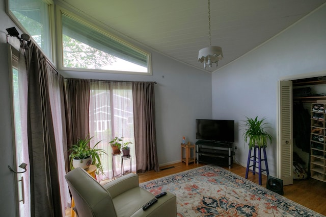 1224 Tee Up Ln, Red Wing, MN 55066 - living area with vaulted ceiling, wood finished floors, and ornamental molding