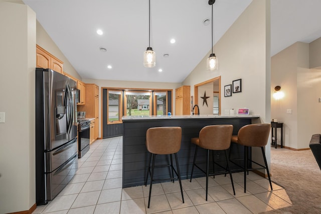 kitchen with a kitchen breakfast bar, black electric range, light brown cabinetry, fridge with ice dispenser, and a peninsula