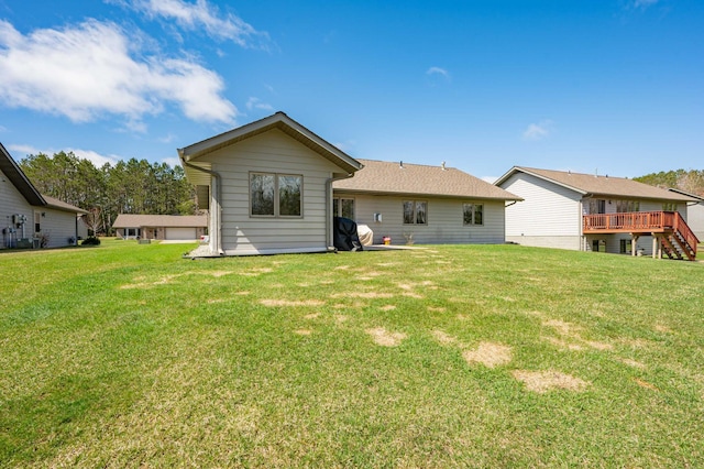 back of property featuring a lawn