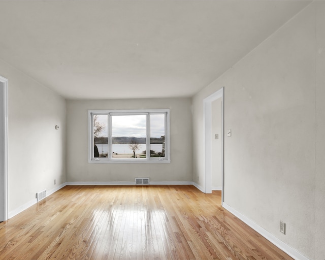 1217 High St, Lake City, MN 55041 - unfurnished room with light wood finished floors and baseboards