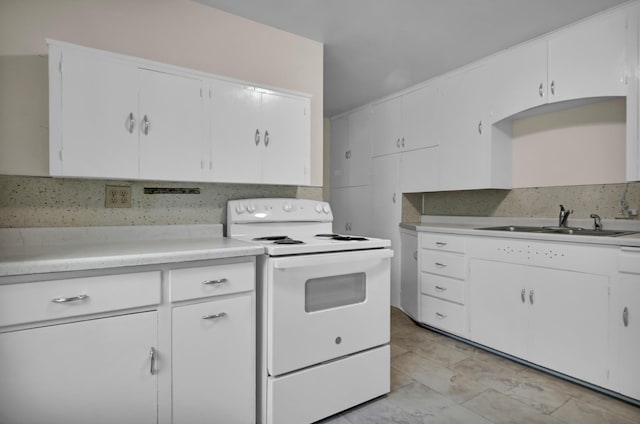1217 High St, Lake City, MN 55041 - kitchen with white range with electric stovetop, a sink, light countertops, and white cabinetry