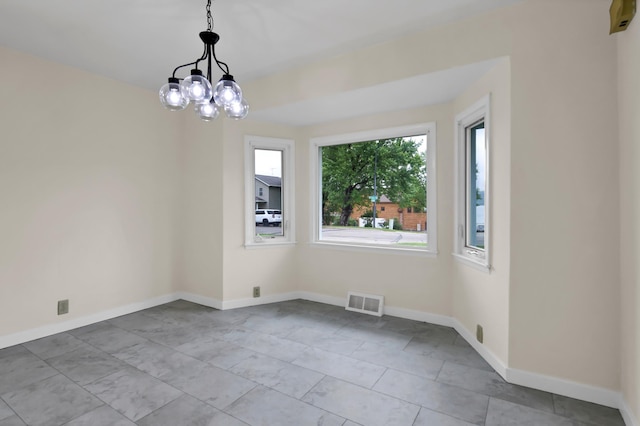 1217 High St, Lake City, MN 55041 - spare room featuring a chandelier and baseboards