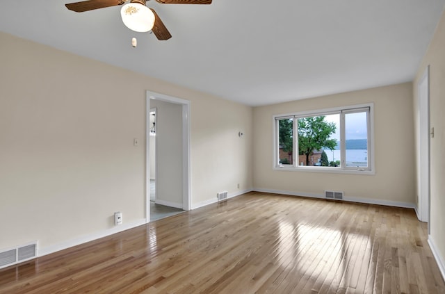 1217 High St, Lake City, MN 55041 - empty room with wood-type flooring, ceiling fan, and baseboards