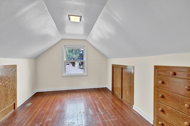 1217 High St, Lake City, MN 55041 - additional living space featuring wood-type flooring, vaulted ceiling, and baseboards