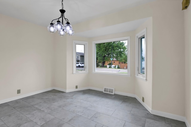 1217 High St, Lake City, MN 55041 - empty room with a chandelier and baseboards