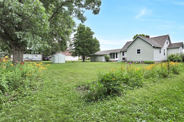 1217 High St, Lake City, MN 55041 - view of grassy yard featuring a storage unit