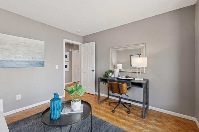 office space featuring baseboards