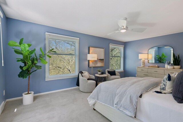 bedroom with baseboards, ceiling fan, and carpet