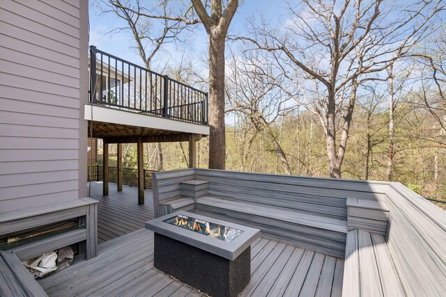 deck with an outdoor fire pit