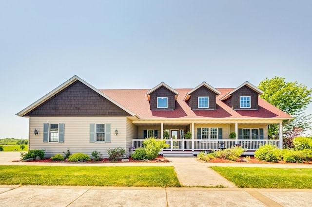 craftsman-style house with a porch and a front lawn