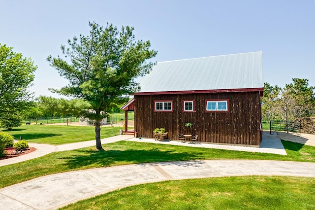 view of outbuilding with fence