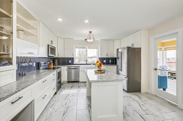 kitchen with backsplash, appliances with stainless steel finishes, white cabinets, marble finish floor, and recessed lighting